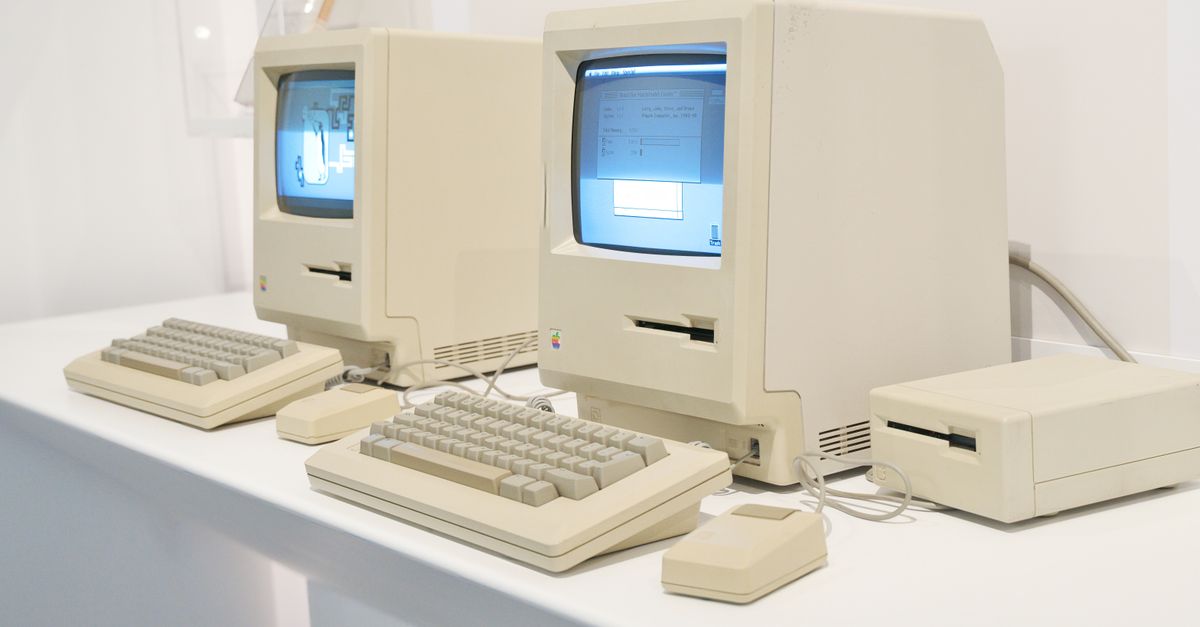 Close-up of retro Apple Macintosh computers showcasing early personal computing history.